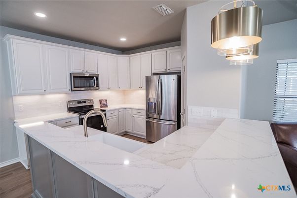 Interior, Kitchen, Marble, Recessed Lighting, Stainless Steel Appliances, Wood Texture Flooring
