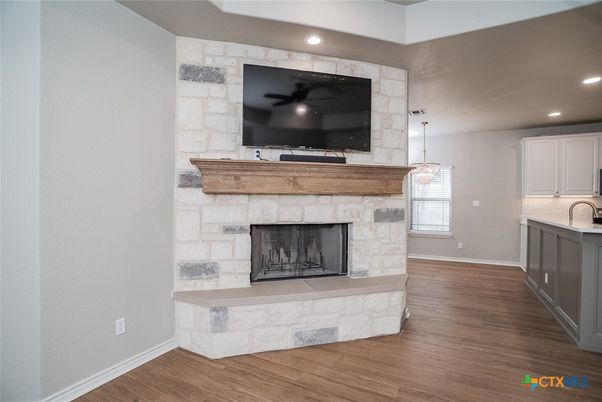Fireplace, Interior, Pendant Lights, Recessed Lighting, Stone Walls, Wood Texture Flooring