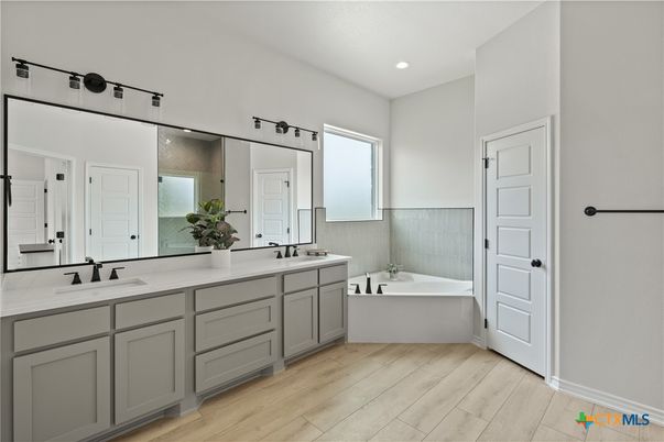 Bathroom, Dual Sink Vanities, Free Standing Baths, Interior, Recessed Lighting, Wood Texture Flooring