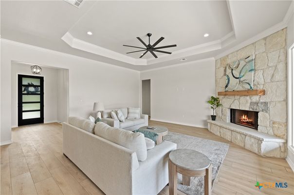 Fireplace, Interior, Living room, Recessed Lighting, Stone Walls, Wood Texture Flooring
