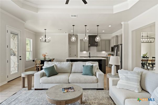 Chandelier, Dining room, Interior, Kitchen, Living room, Pendant Lights, Recessed Lighting, Stainless Steel Appliances, Wood Texture Flooring