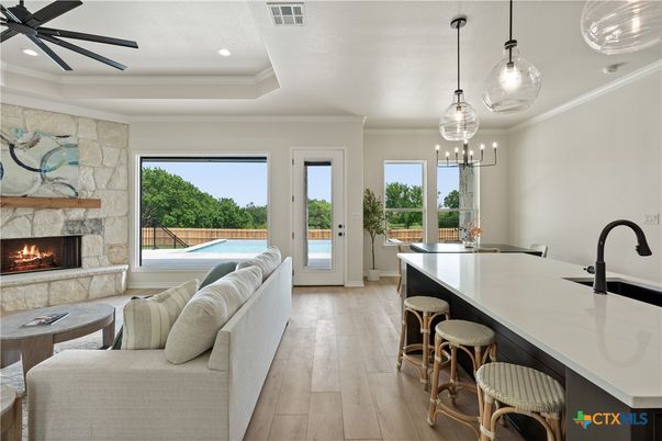 Fireplace, Interior, Kitchen, Living room, Pendant Lights, Recessed Lighting, Stone Walls, Wood Texture Flooring