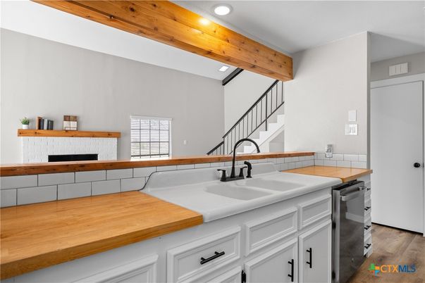 Fireplace, Interior, Kitchen, Recessed Lighting, Tile Countertops, Wood Texture Flooring