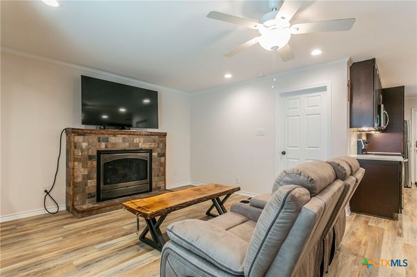 Fireplace, Interior, Living room, Recessed Lighting, Wood Texture Flooring