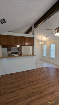Chandelier, Empty room, Interior, Kitchen, Stainless Steel Appliances, Wooden Beams, Wood Texture Flooring