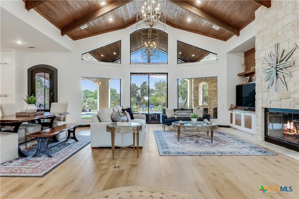 Chandelier, Dining room, Fireplace, Interior, Living room, Recessed Lighting, Stone Walls, Wooden Beams, Wooden Ceilings, Wood Texture Flooring