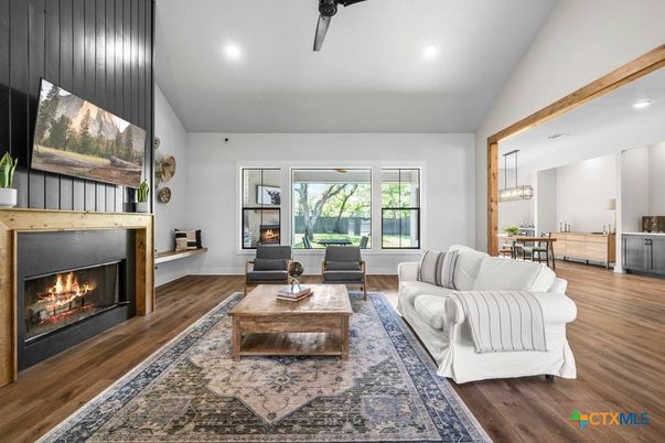 Dining room, Fireplace, Interior, Living room, Pendant Lights, Recessed Lighting, Wood Texture Flooring
