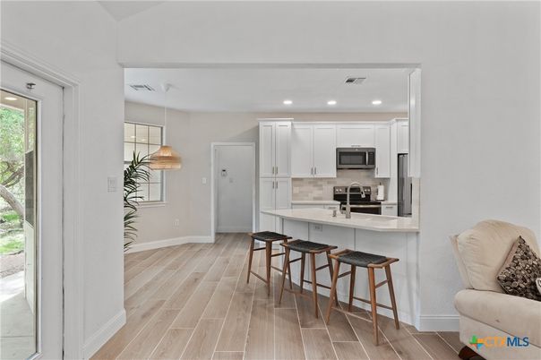 Interior, Kitchen, Pendant Lights, Recessed Lighting, Stainless Steel Appliances, Wood Texture Flooring
