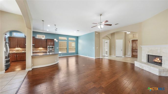 Empty room, Fireplace, Interior, Kitchen, Pendant Lights, Recessed Lighting, Wood Texture Flooring