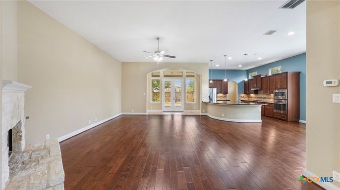 Empty room, Fireplace, Interior, Kitchen, Pendant Lights, Recessed Lighting, Wood Texture Flooring