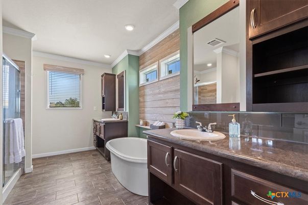 Bathroom, Dual Sink Vanities, Free Standing Baths, Interior, Recessed Lighting, Wood Texture Flooring