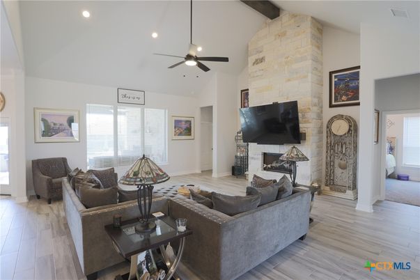 Fireplace, Interior, Living room, Recessed Lighting, Stone Walls, Wooden Beams, Wood Texture Flooring