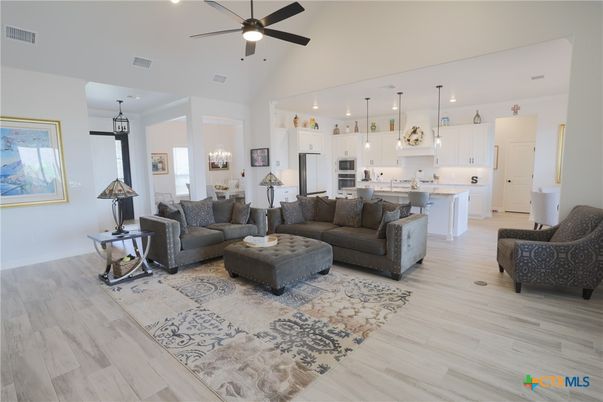 Chandelier, Dining room, Interior, Kitchen, Living room, Pendant Lights, Recessed Lighting, Stainless Steel Appliances, Wood Texture Flooring