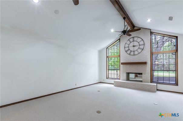 Empty room, Fireplace, Interior, Recessed Lighting, Stone Walls, Wooden Beams