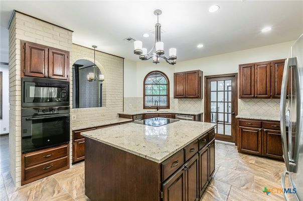Chandelier, Interior, Kitchen, Recessed Lighting, Stainless Steel Appliances, Stone Walls