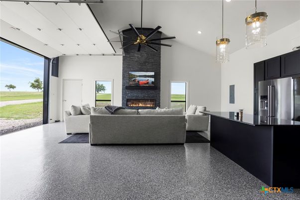 Fireplace, Interior, Kitchen, Living room, Pendant Lights, Recessed Lighting, Stainless Steel Appliances, Stone Walls