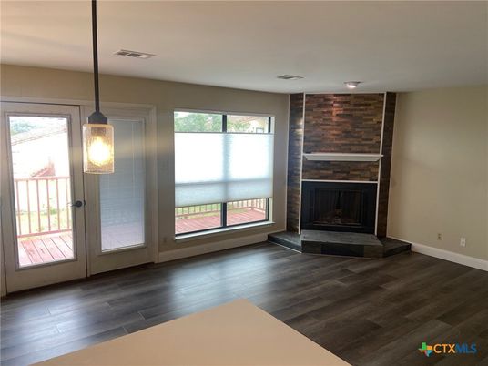 Empty room, Fireplace, Interior, Pendant Lights, Stone Walls, Wood Texture Flooring