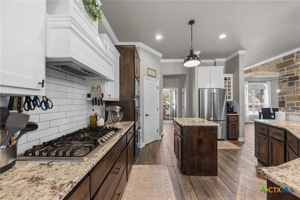 Interior, Kitchen, Pendant Lights, Recessed Lighting, Stainless Steel Appliances, Stone Walls, Wood Texture Flooring