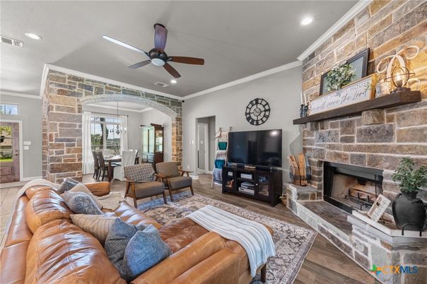 Dining room, Fireplace, Interior, Living room, Pendant Lights, Recessed Lighting, Stone Walls, Wood Texture Flooring