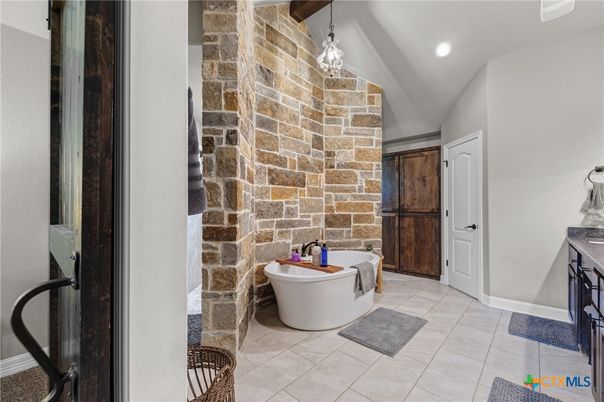 Bathroom, Free Standing Baths, Interior, Pendant Lights, Recessed Lighting, Stone Walls