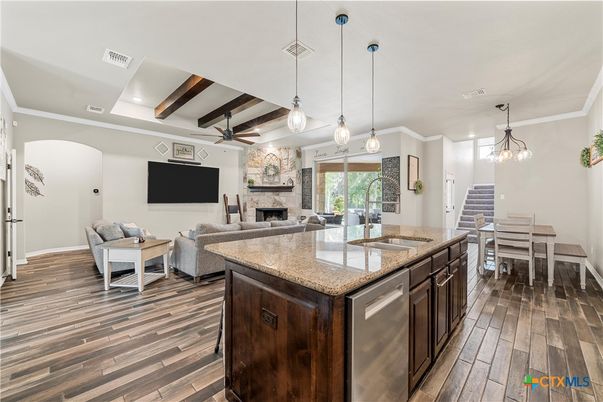 Dining room, Fireplace, Interior, Kitchen, Living room, Pendant Lights, Recessed Lighting, Stone Walls, Wooden Beams, Wood Texture Flooring