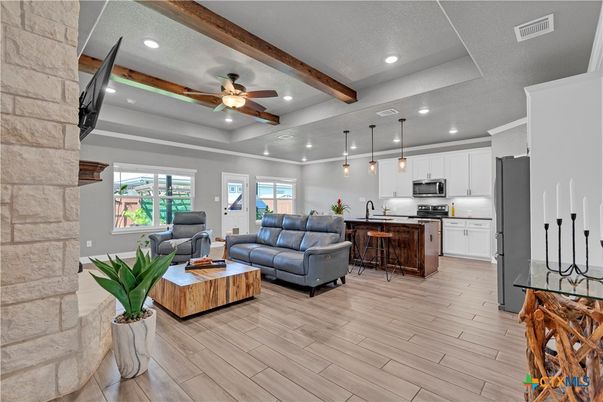 Interior, Kitchen, Living room, Pendant Lights, Recessed Lighting, Stainless Steel Appliances, Stone Walls, Wooden Beams, Wood Texture Flooring