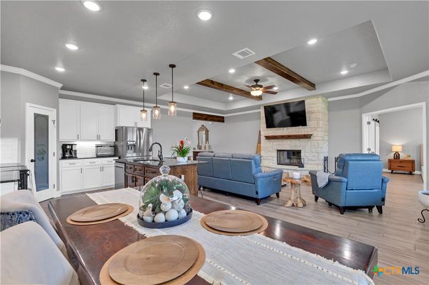 Dining room, Fireplace, Interior, Kitchen, Living room, Pendant Lights, Recessed Lighting, Stainless Steel Appliances, Stone Walls, Wood Texture Flooring
