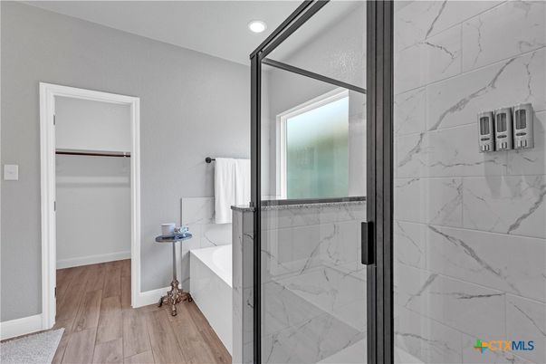 Bathroom, Glass Shower, Interior, Marble Walls, Recessed Lighting, Wood Texture Flooring