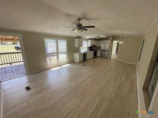 Empty room, Interior, Kitchen, Pendant Lights, Stainless Steel Appliances, Wood Texture Flooring