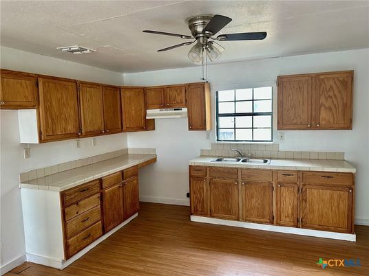 Interior, Kitchen, Tile Countertops, Wood Texture Flooring