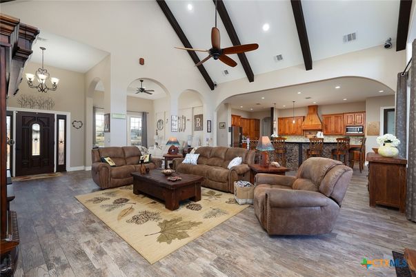 Chandelier, Interior, Kitchen, Living room, Pendant Lights, Recessed Lighting, Stainless Steel Appliances, Wood Texture Flooring