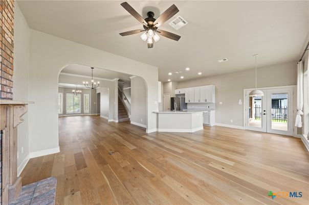 Chandelier, Empty room, Interior, Kitchen, Pendant Lights, Recessed Lighting, Stainless Steel Appliances, Wood Texture Flooring