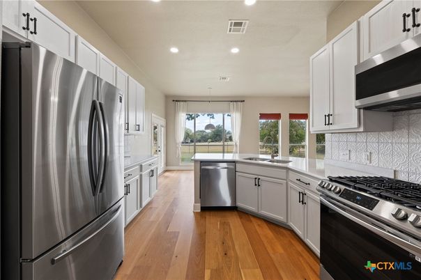 Interior, Kitchen, Pendant Lights, Recessed Lighting, Stainless Steel Appliances, Wood Texture Flooring