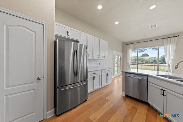 Interior, Kitchen, Recessed Lighting, Stainless Steel Appliances, Wood Texture Flooring