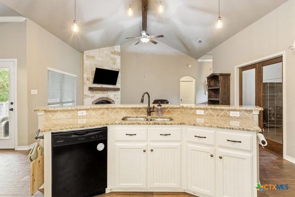 Fireplace, Interior, Kitchen, Pendant Lights, Recessed Lighting, Stone Walls, Wood Texture Flooring