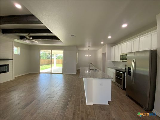 Fireplace, Interior, Kitchen, Pendant Lights, Recessed Lighting, Stainless Steel Appliances, Wood Texture Flooring