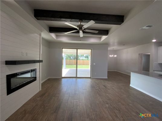 Empty room, Fireplace, Interior, Pendant Lights, Recessed Lighting, Wooden Beams, Wood Texture Flooring