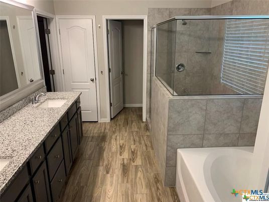 Bathroom, Dual Sink Vanities, Glass Shower, Interior, Wood Texture Flooring