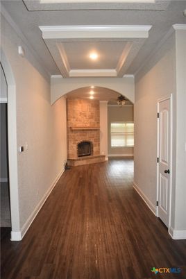 Empty room, Fireplace, Interior, Recessed Lighting, Stone Walls, Wood Texture Flooring