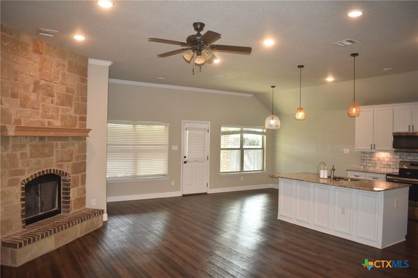 Fireplace, Interior, Kitchen, Pendant Lights, Recessed Lighting, Stone Walls, Wood Texture Flooring