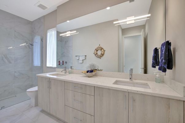 Bathroom, Dual Sink Vanities, Glass Shower, Interior, Marble, Marble Walls, Recessed Lighting