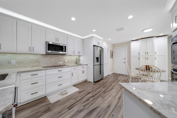 Dining room, Interior, Kitchen, Recessed Lighting, Stainless Steel Appliances, Wood Texture Flooring