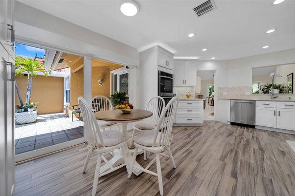Dining room, Interior, Kitchen, Recessed Lighting, Stainless Steel Appliances, Wood Texture Flooring