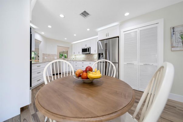 Dining room, Interior, Kitchen, Recessed Lighting, Stainless Steel Appliances, Wood Texture Flooring