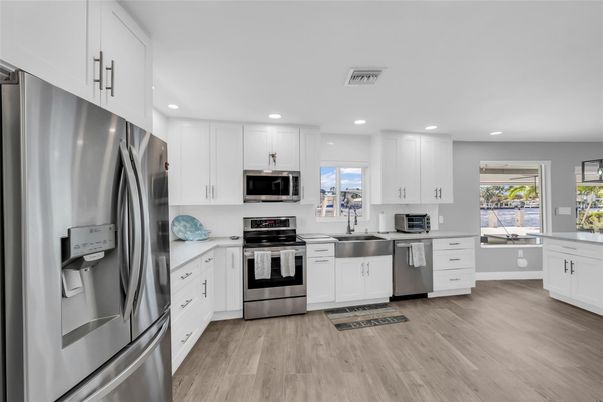 Interior, Kitchen, Recessed Lighting, Stainless Steel Appliances, Wood Texture Flooring