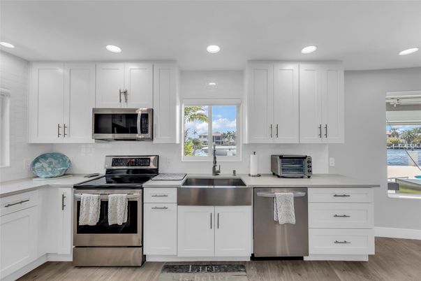 Interior, Kitchen, Recessed Lighting, Stainless Steel Appliances, Wood Texture Flooring
