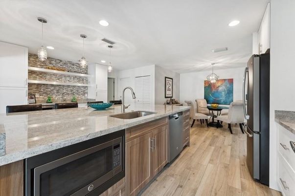Dining room, Interior, Kitchen, Pendant Lights, Recessed Lighting, Stainless Steel Appliances, Wood Texture Flooring