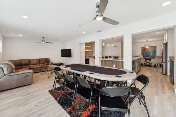 Dining room, Game Room, Interior, Living room, Pendant Lights, Recessed Lighting, Wood Texture Flooring