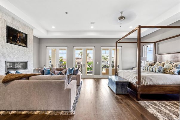 Bedroom, Fireplace, Interior, Living room, Recessed Lighting, Stone Walls, Wood Texture Flooring