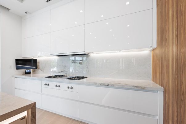Interior, Kitchen, Marble Walls, Recessed Lighting, Stainless Steel Appliances, Wood Texture Flooring